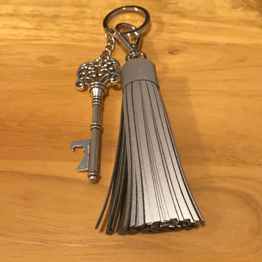 Keychain with reflective tassel and key charm